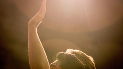 Student in chapel worshipping